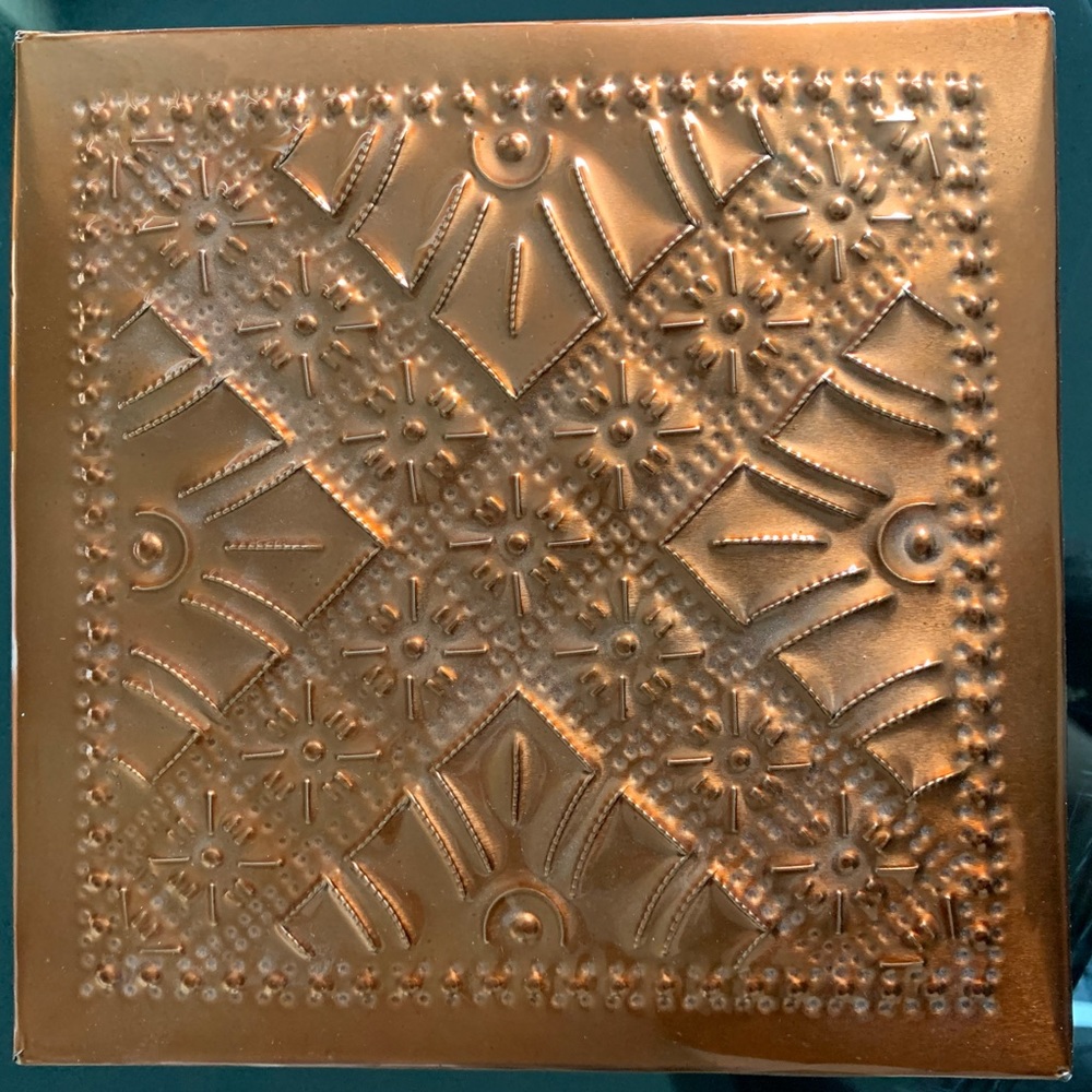 Copper colored pressed tin box